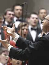 Photo of the conductor conducting a choir