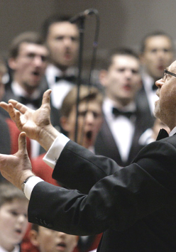 Photo of the conductor conducting a choir