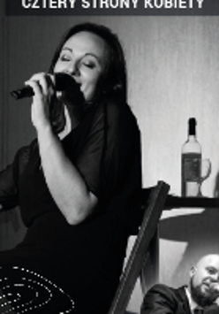 Black and white photo of a woman singing to the microphone.
