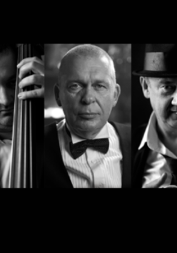 Black and white picture of Adam Nowak and musicians from Akustyk Amigos band