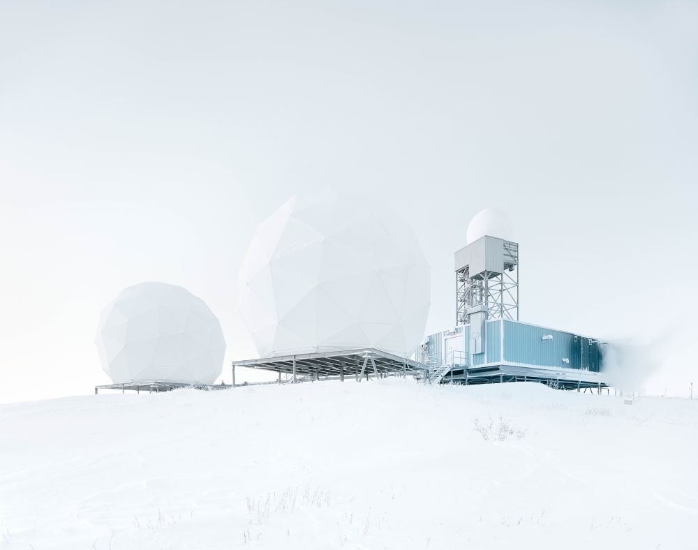 photograph: Gregor Sailer An object with a large, round lamp in a snowy, foggy wasteland.