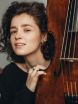 A photo of the artist - a young woman by a cello