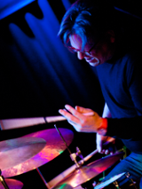Photo of the musician playing drums