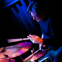 Photo of the musician playing drums