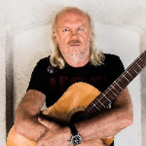 Photo of Andrzej Sikorowski - a man holding a guitar