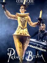 Photo of a woman dressed in a golden Lumiere (candelabra) costume against a dark background