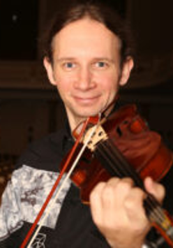Photo of the artist - Marcin Herman playing the violin