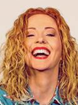 Photo of the artist's smiling face.