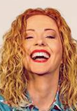 Photo of the artist's smiling face.