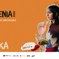 Picture of the artist on orange background among flowers