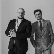 Black and white photo of two performers: Kacper Smoliński and Bartek Miler