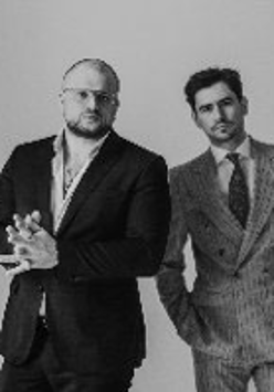 Black and white photo of two performers: Kacper Smoliński and Bartek Miler