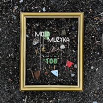 Concert poster: golden frame put on the ground, with some small objects inside it.