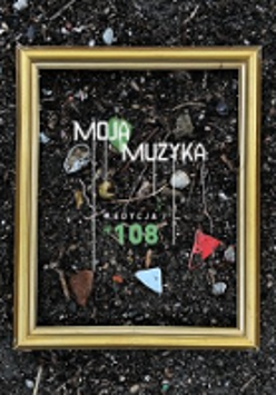 Concert poster: golden frame put on the ground, with some small objects inside it.