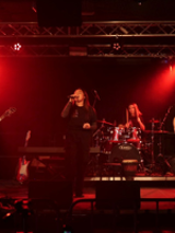 Photo of a band performing on stage.