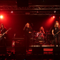 Photo of a band performing on stage.