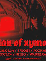 Concert poster in black and red colours: photo of a man in a dark corridor and information about the event.