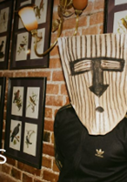 Photo of a person with a mask on his face.