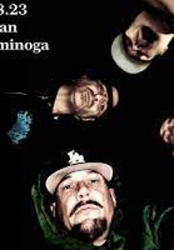 Photo of four members of the band's faces. Black backgroud.