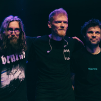 Photo of the band Dziwna Wiosna - three men standing next to each other.