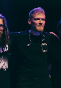 Photo of the band Dziwna Wiosna - three men standing next to each other.