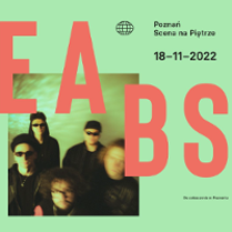 Concert poster - photo of a band and information about the event.