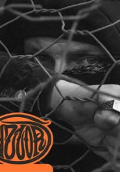 Black and white photo of a partly covered man's face behind mesh fence