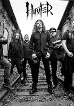 Black and white concert poster with band photo.