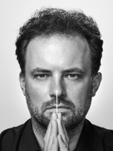 Black and white photo of the conductor, Łukasz Borowicz