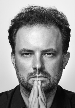 Black and white photo of the conductor, Łukasz Borowicz