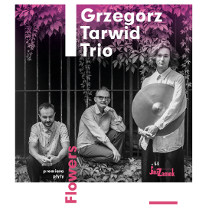 Black and white photo of the band. Ivy and metal fence as background