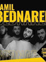 Concert poster: black and white photo pf Kamil Bednarek and yellow text "Kamil Bednarek".
