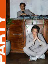 Photo of three men: one is sitting in front of a sideboard, one is laying on it and one is standing behind it. On the left side the title of the concert tour.