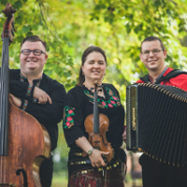 Photo of the band members:a woman and two men in folk costumes, holding their musical instruments.
