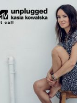 Concert poster with photo of Kasia Kowalska, who is sitting on a high stool.