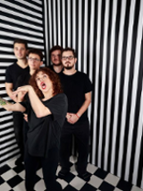 Photo of the band members dressed in black. BLack and white stripes as a background.