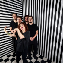 Photo of the band members dressed in black. BLack and white stripes as a background.