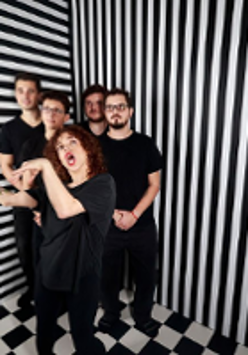 Photo of the band members dressed in black. BLack and white stripes as a background.