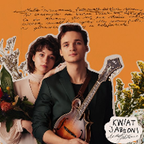 Picture of the artists among flowers on orange background.