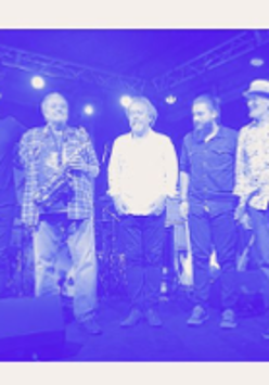 Photo of the band in blue colours.