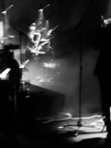 lLack and white photo of a person performing on stage.