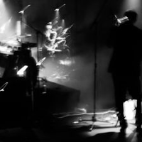 lLack and white photo of a person performing on stage.