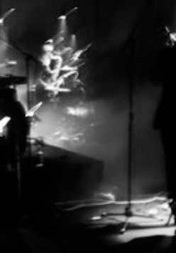 lLack and white photo of a person performing on stage.