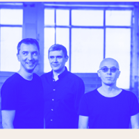 Blue-coloured photo of three men.