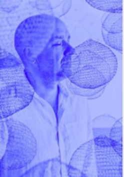 Photo of Marek Napiórkowski in blue colours.