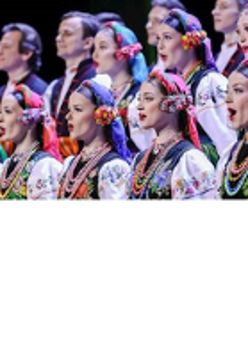 Photo of the women and men in two rows in traditional folk costumes.