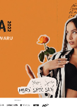 Picture of the artist on orange background among flowers