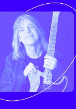 Photo in blue colours of Mike Stern, who is holding a guitar.