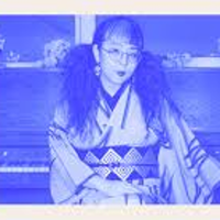 BLue and white photo of Miki Yamanaka.