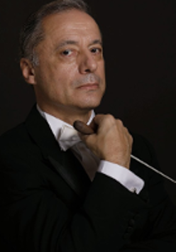 Photo of the conductor, Marco Guidarini.